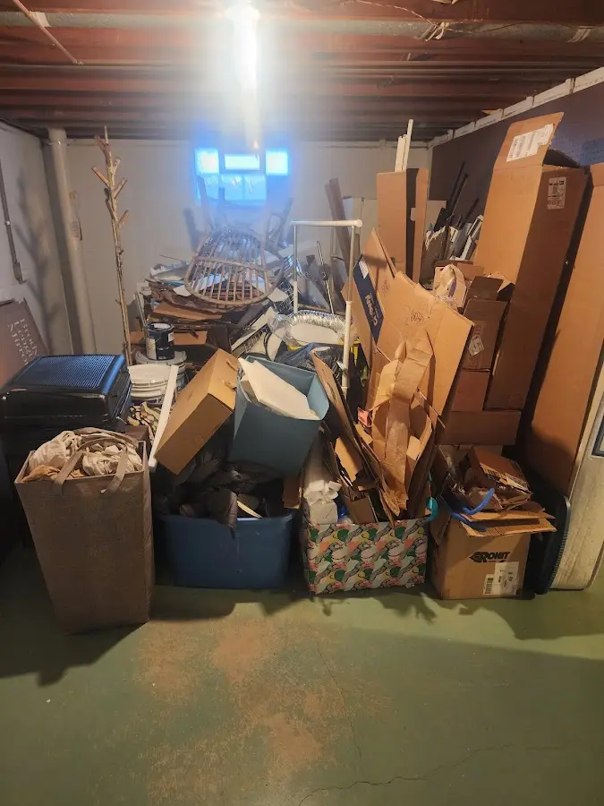 Roll-off dumpster container at job site for 2 Yard Dumpster Rental in Dunlap